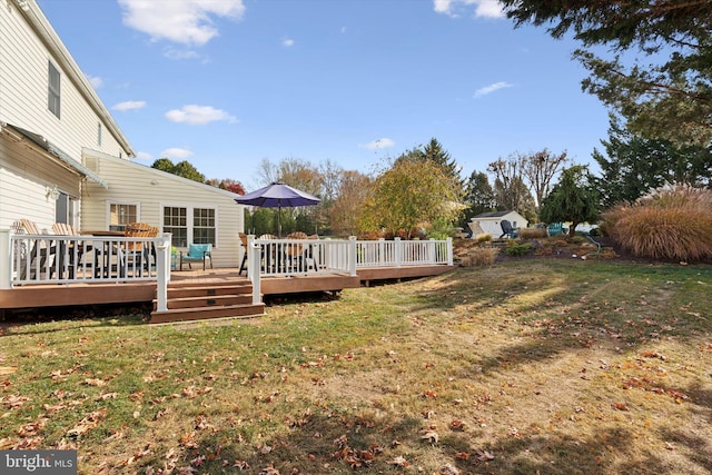 view of yard with a wooden deck