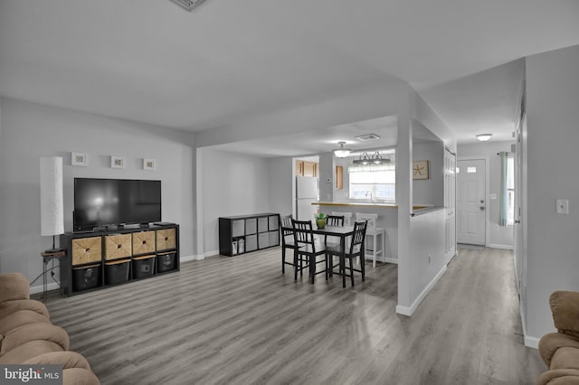 living room with wood finished floors and baseboards