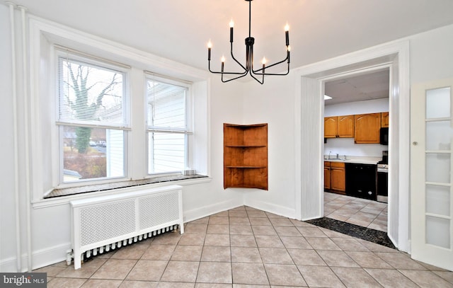 unfurnished dining area with light tile patterned flooring, radiator, sink, and a notable chandelier