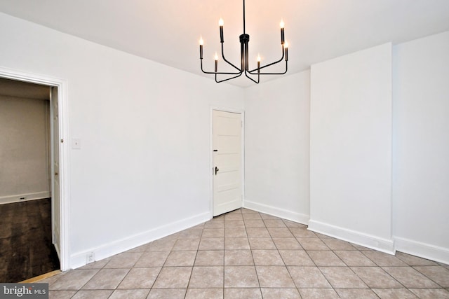 unfurnished dining area featuring a chandelier and light tile patterned floors