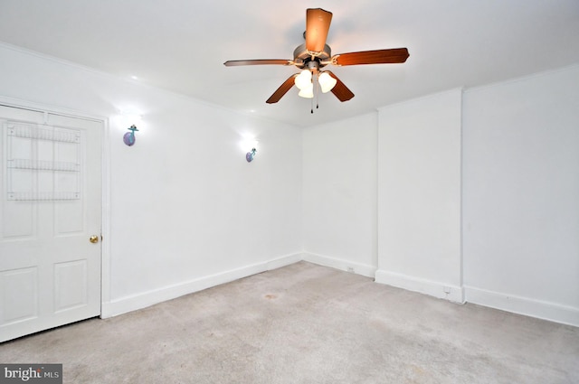 empty room with light colored carpet and ceiling fan