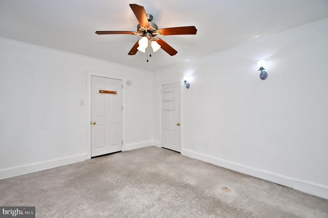 unfurnished room with ceiling fan and light colored carpet