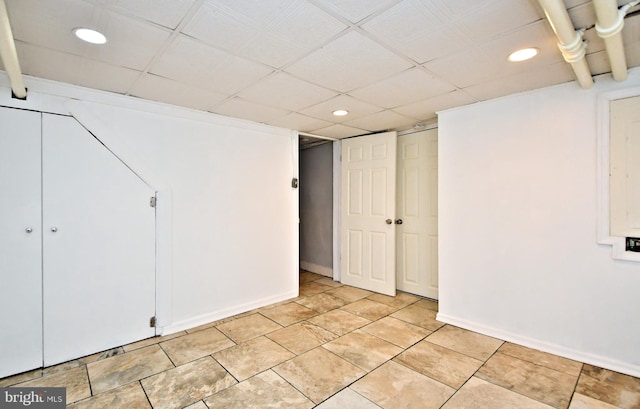 basement with a drop ceiling