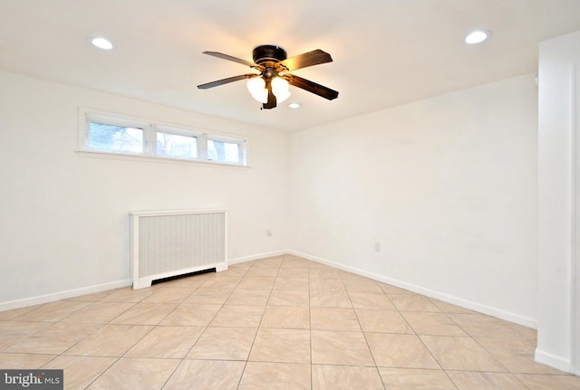 empty room with radiator and ceiling fan