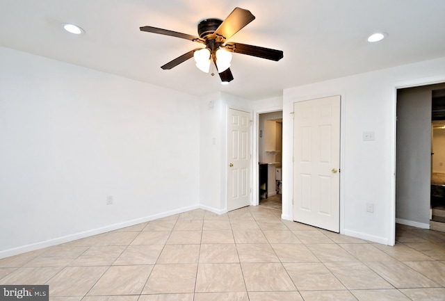 unfurnished bedroom featuring ceiling fan and light tile patterned floors