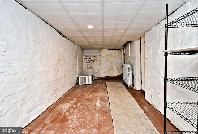 basement featuring radiator heating unit