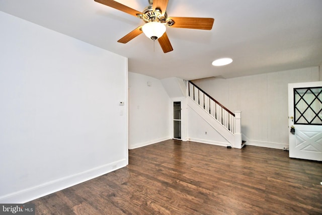 unfurnished living room featuring ceiling fan and dark hardwood / wood-style floors