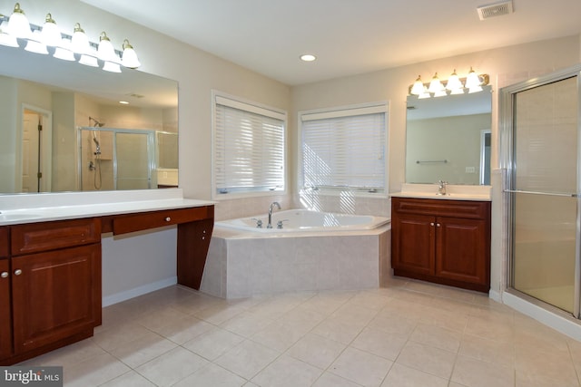 bathroom featuring vanity, shower with separate bathtub, and tile patterned floors