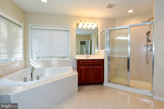 bathroom with vanity, independent shower and bath, and tile patterned flooring