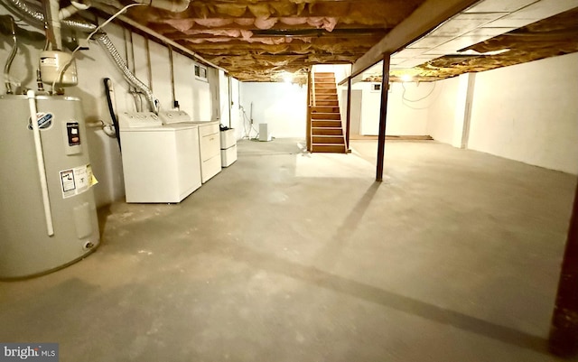 basement with washer and dryer and water heater