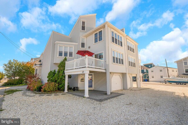 back of property featuring a garage