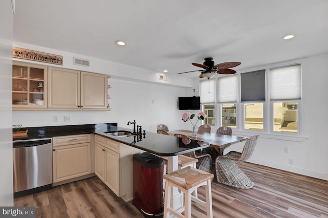 694 21st St, Avalon, NJ 08202 - kitchen with a sink, visible vents, a peninsula, dishwasher, and dark wood finished floors