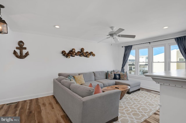 694 21st St, Avalon, NJ 08202 - living area featuring light wood-style floors, a ceiling fan, crown molding, and baseboards