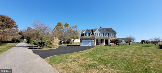 front facade with a garage and a front lawn