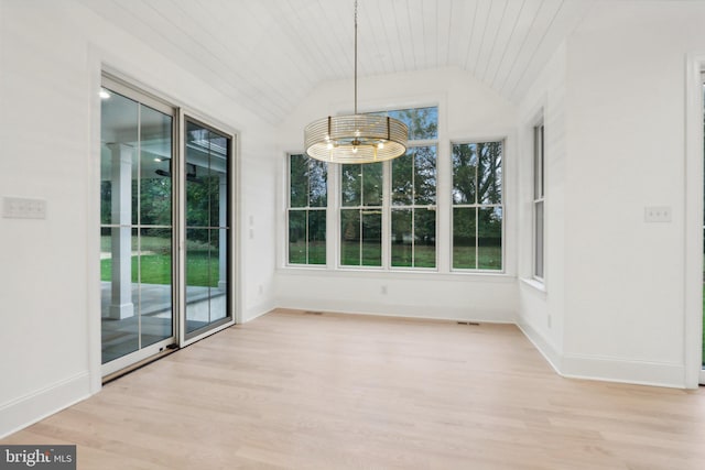 unfurnished dining area featuring wood ceiling, lofted ceiling, light hardwood / wood-style flooring, and an inviting chandelier