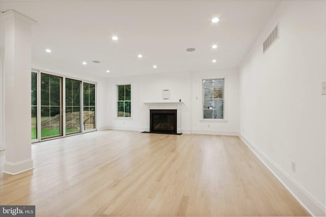 unfurnished living room with light hardwood / wood-style floors