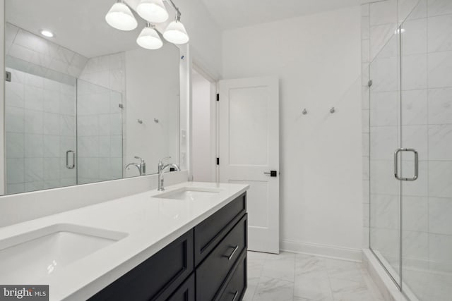 bathroom with vanity and a shower with shower door