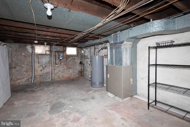 basement with water heater and heating unit