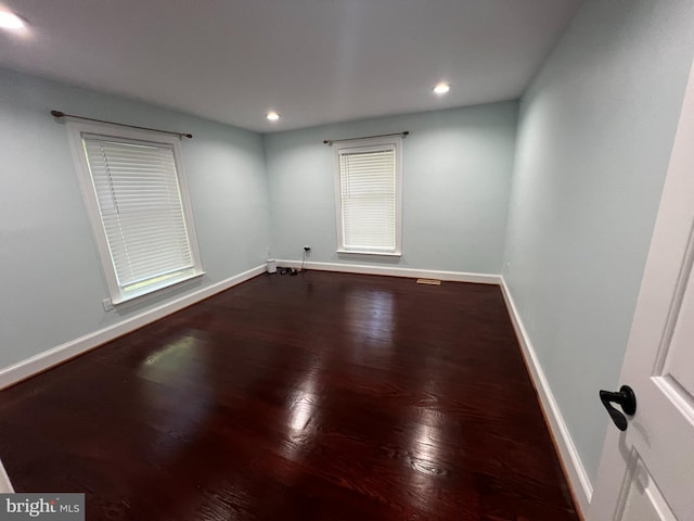 empty room featuring hardwood / wood-style flooring