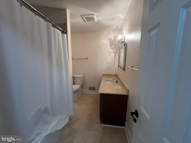 bathroom with toilet, curtained shower, and vanity