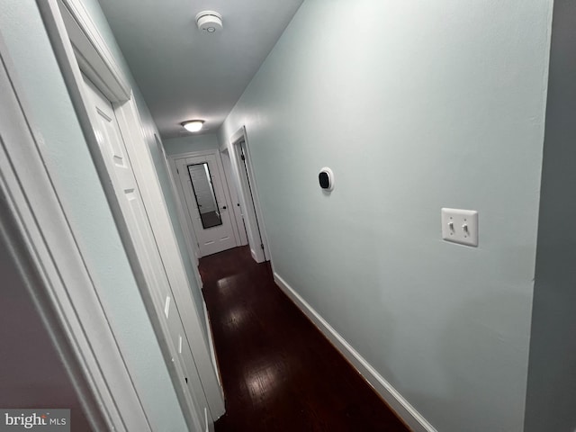 hallway featuring dark hardwood / wood-style floors