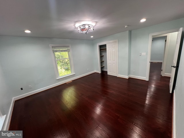 empty room featuring dark hardwood / wood-style floors