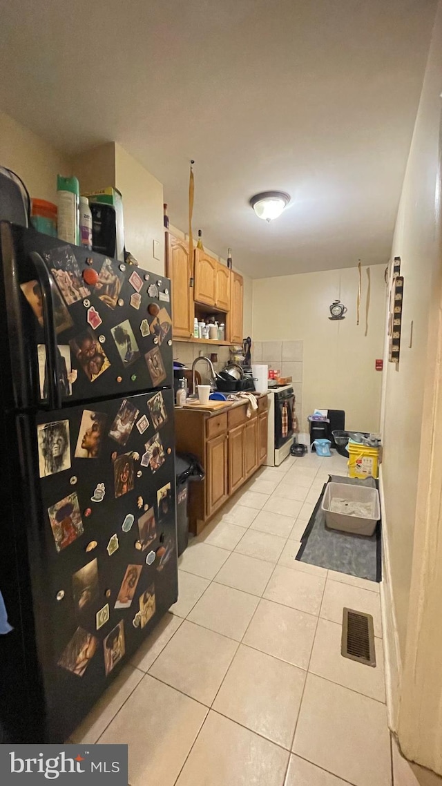 kitchen with sink and light tile patterned flooring