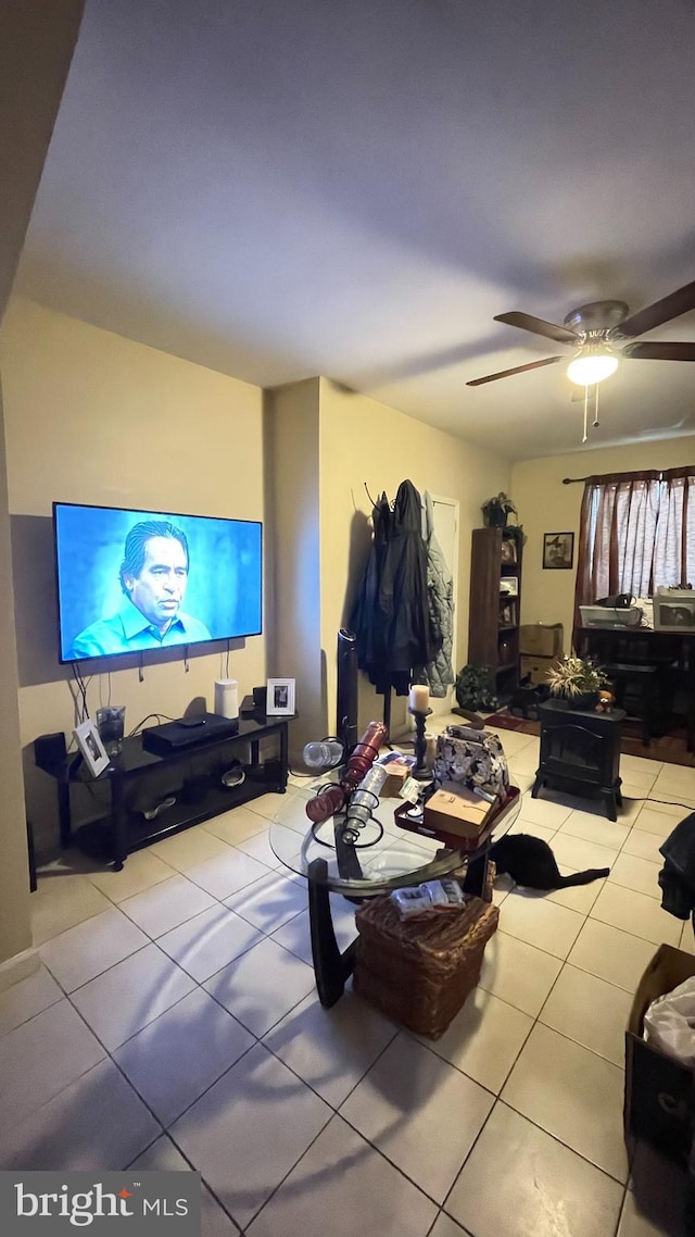 tiled living room with ceiling fan