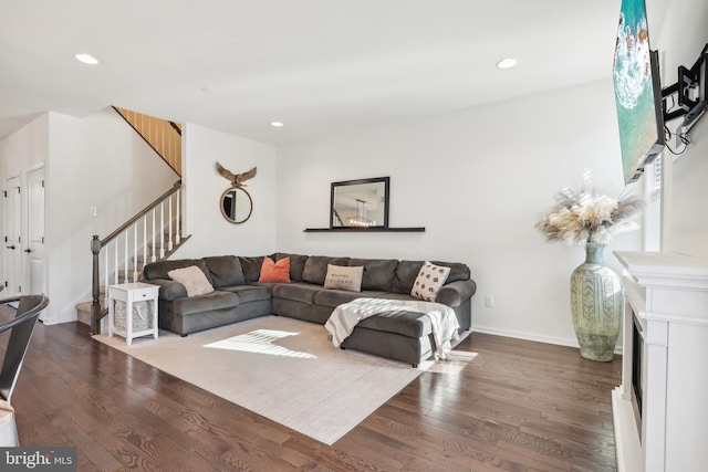 living room featuring dark wood-type flooring