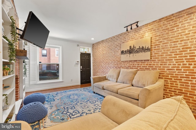 living room with brick wall