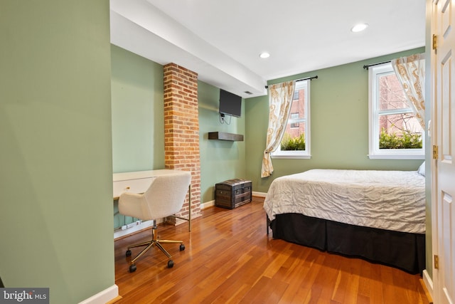 bedroom with wood-type flooring