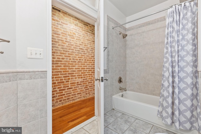 bathroom featuring shower / tub combo with curtain and tile patterned flooring