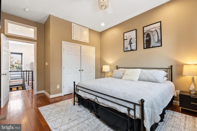 bedroom featuring dark hardwood / wood-style floors and a closet