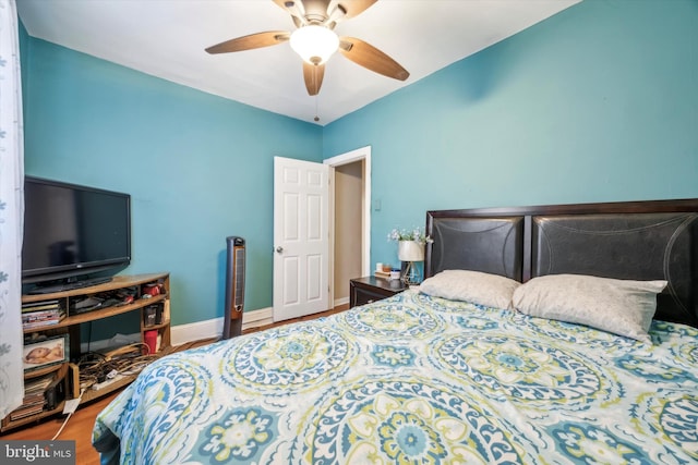 bedroom featuring hardwood / wood-style floors and ceiling fan