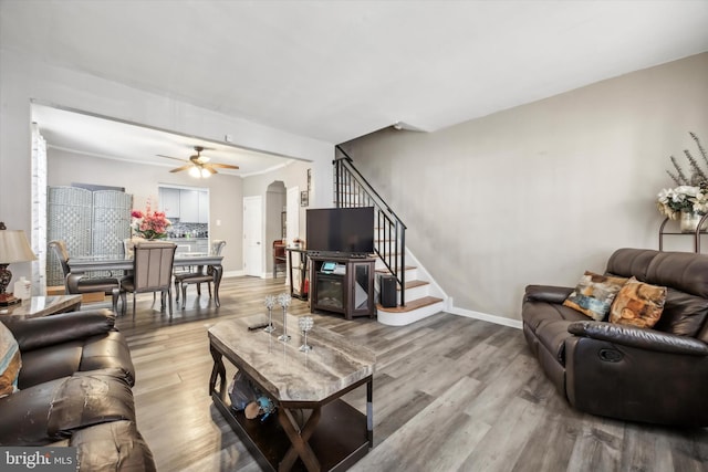 living room featuring hardwood / wood-style flooring and ceiling fan