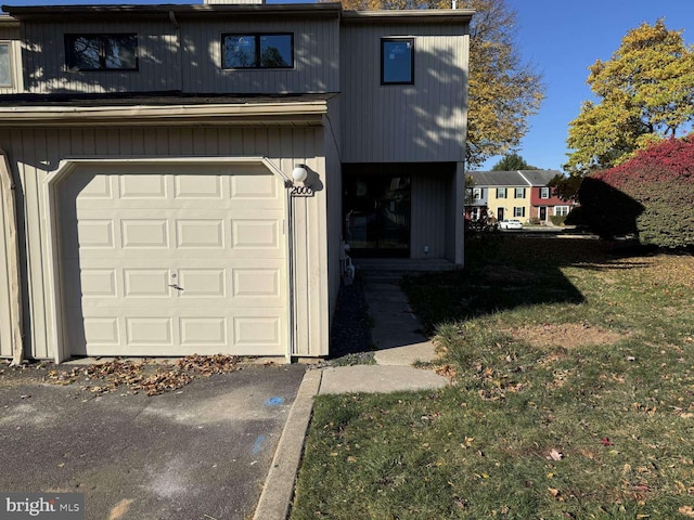 garage featuring a lawn