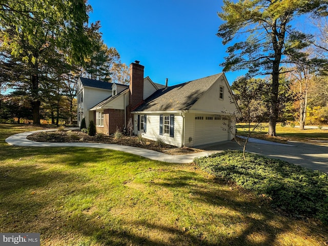 view of side of home with a lawn