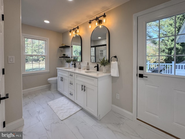 bathroom featuring vanity and toilet