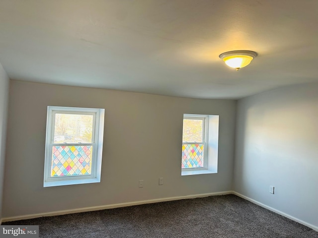 carpeted empty room featuring a healthy amount of sunlight