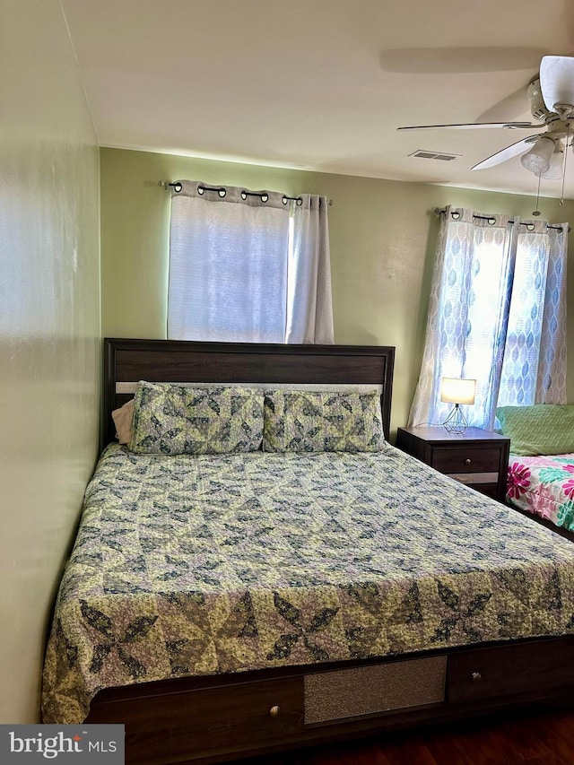 bedroom featuring dark hardwood / wood-style floors and ceiling fan