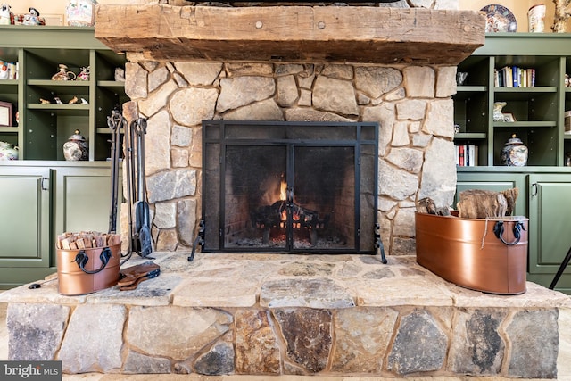 room details featuring a stone fireplace