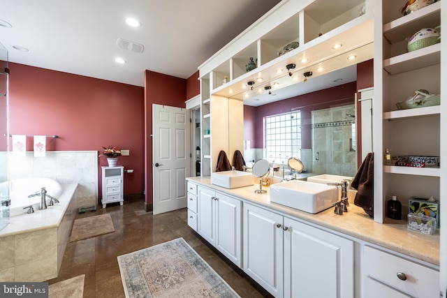 bathroom with visible vents, double vanity, recessed lighting, a stall shower, and a bath