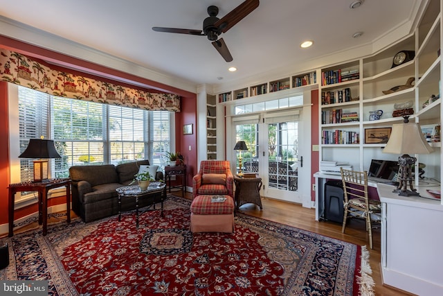 living room with a wealth of natural light, recessed lighting, a ceiling fan, and wood finished floors