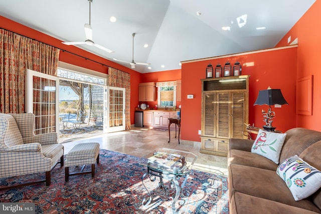 living area featuring recessed lighting, a ceiling fan, baseboards, and high vaulted ceiling