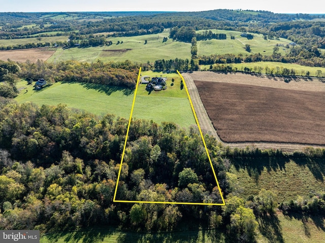 birds eye view of property with a rural view