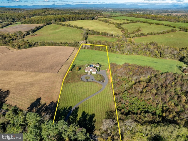 drone / aerial view with a rural view and a mountain view