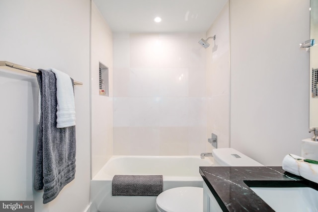 full bathroom featuring vanity, toilet, and tiled shower / bath