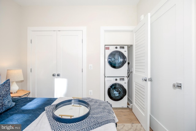 washroom with stacked washer / dryer