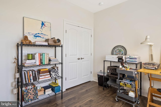 home office with dark wood-type flooring