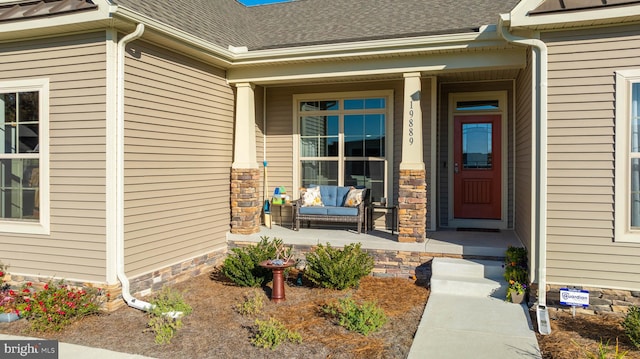 doorway to property featuring covered porch